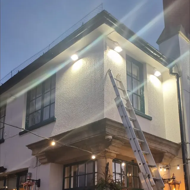 Floodlights fitted to a commercial building's front elevation