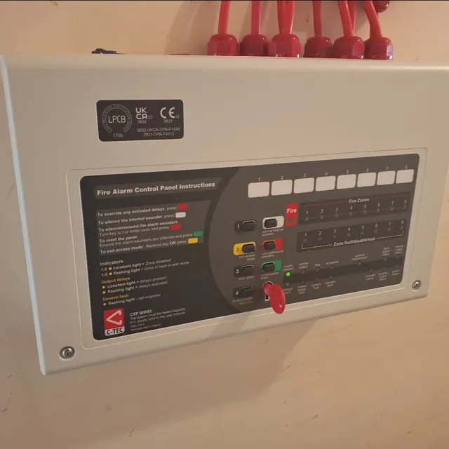 Eight-zone fire alarm control panel installed on a wall